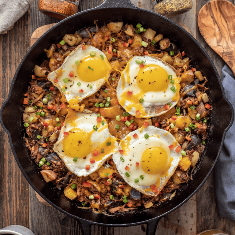 Pulled Pork Hash with Eggs Over Cheesy
